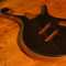 Carved arm bevel on a custom bass with an ebony top