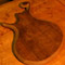 Body bevels on back of a custom bass with black walnut top