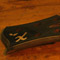 Side of a black walnut bass neck with ebony fretboard