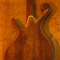 Black walnut back of a fretless custom bass