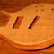 Carved arm bevel on a 5 string custom bass body