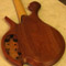 Back of a custom 5 string bass with mahogany body
