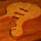 Scroll and neck pocket of a flamed maple bass