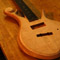 Flamed maple top on a 5 string custom bass