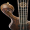 The custom bass guitar body from the top with fretboard inlays, Bartolini pickups, scroll and Hipshot hardware