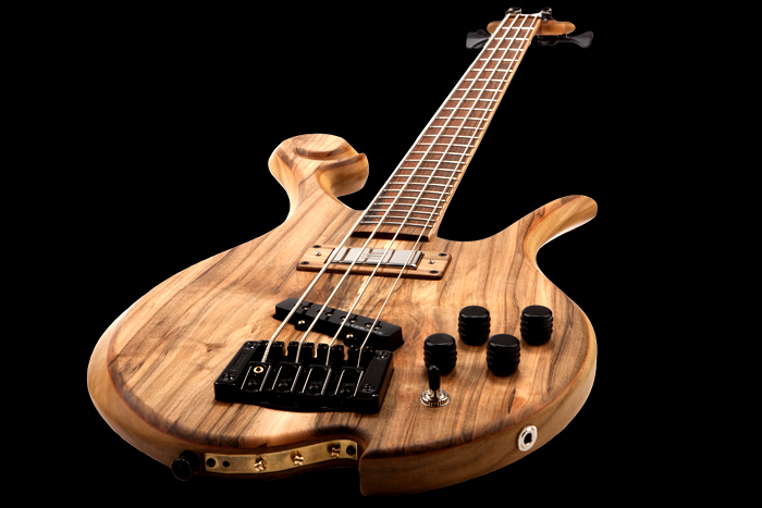 String-thru plate on a Xylem custom bass with top-loaded low E string