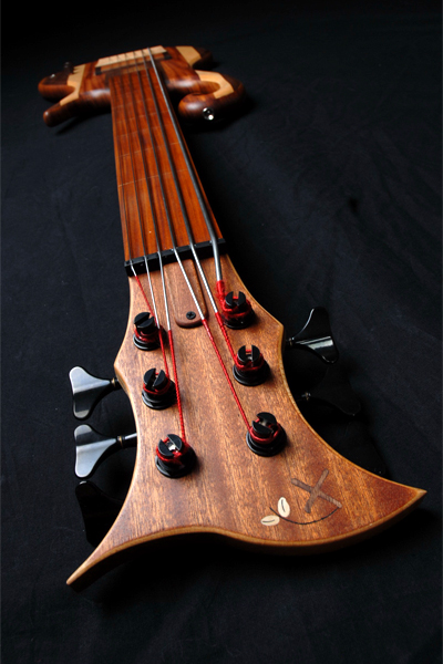Headstock front and Xylem logo inlay of the 6 string fretless bass guitar