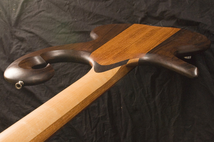 Back of the 4 string bass body including the scroll, neck joint and stringers of the neck