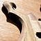Arm bevel on a limba and black walnut metal guitar