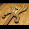 Metal style electric guitar with dual scrolls, limba and black walnut body