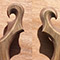 Carved scrolls of a custom guitar with very unique shapes