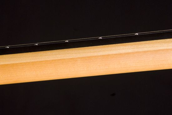 Guitar neck's side w/ ebony binding, rock maple stringer and rock maple core