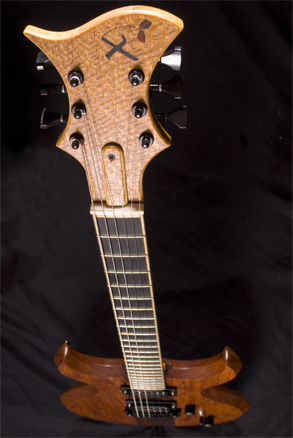 Wide angle of lacewood headstock, ebony fretboard and Brazilian cherry guitar body