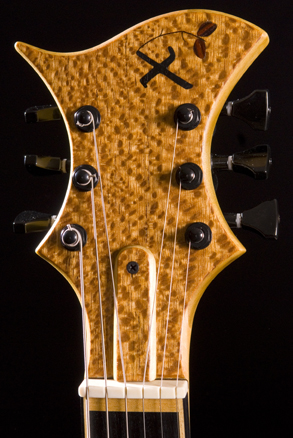Ebony and cocbolo Xylem logo inlay on lacewood veneered headstock