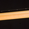 Guitar neck from the side showing ebony binding,rock maple stringer and core