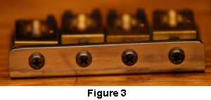 Intonation adjustment screws on a bass bridge