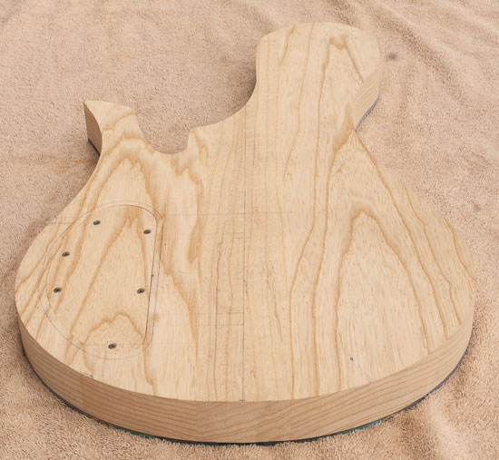 Swamp ash bass guitar body before carving