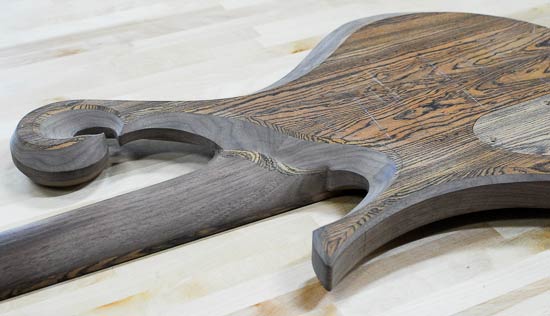 Carved neck heel of a bass guitar build