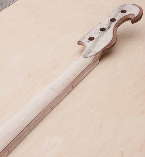Carved profile of a custom bass neck