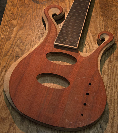 Custom fretless bass with Audere preamp routes, carved