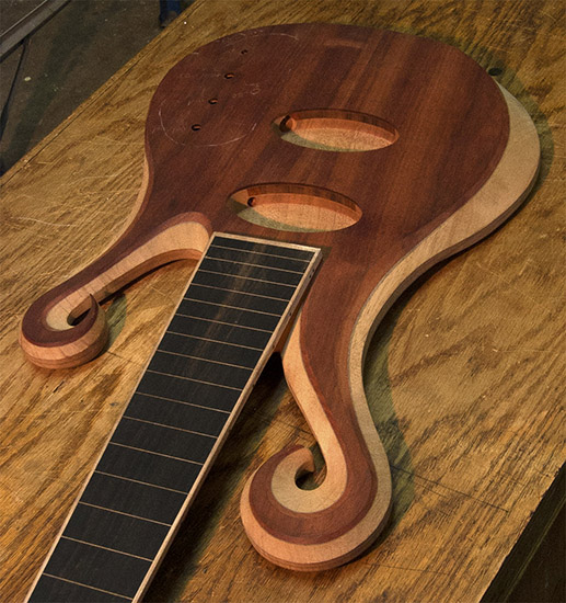 6-string bloodwood bass guitar with lined ebony fingerboard