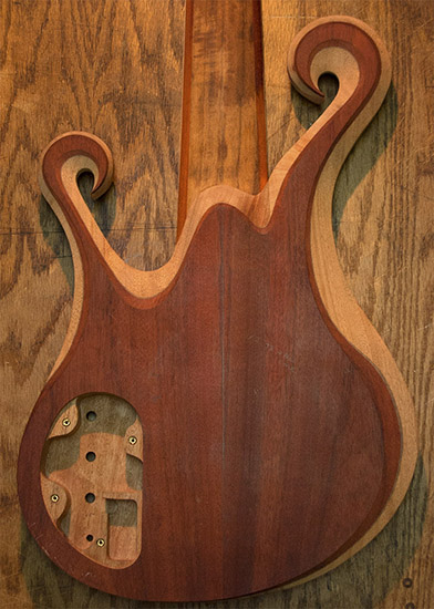 Carved 6-string bass body with bloodwood top, back