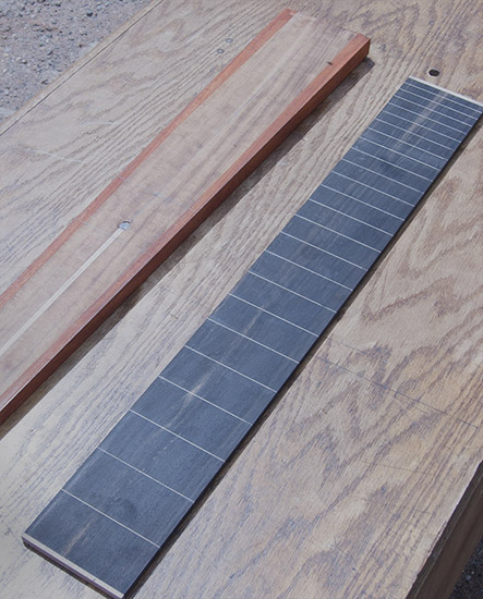 Fretless bass neck with line markers at fret positions