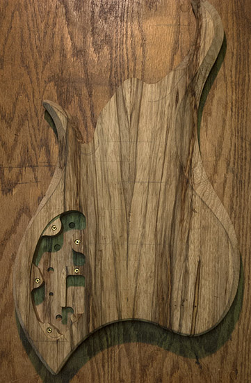 Custom bass body with book matched limba core, back