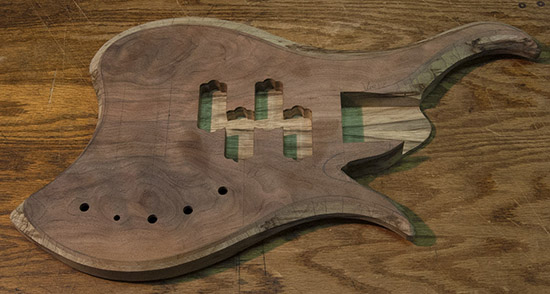 Custom bass with dual P-Bass pickups, walnut top