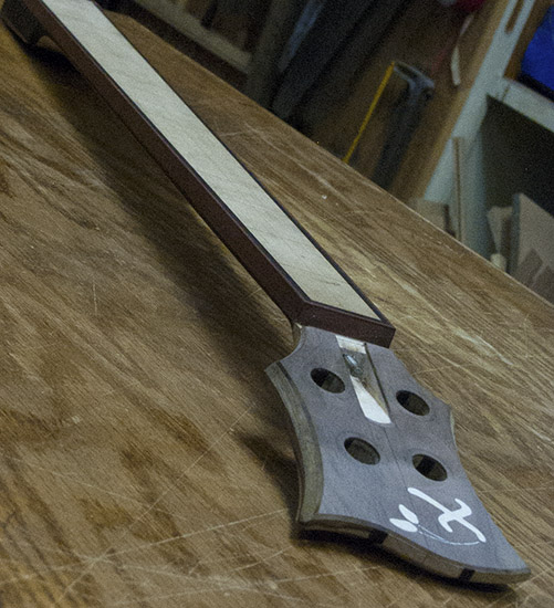 Custom bass neck with ebony stringers, bloodwood binding, walnut headstock