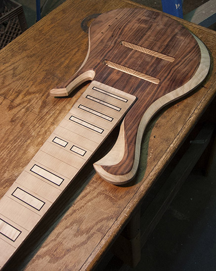 8-string custom bass with block inlays, swamp ash body