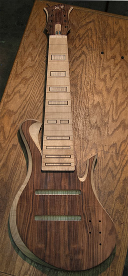 8-string custom bass with ebony block inlays, swamp ash body