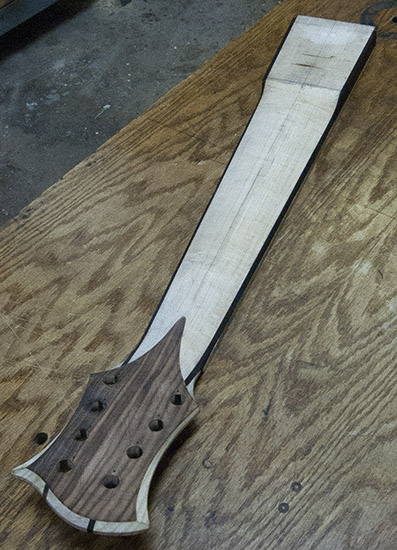 8-string bass neck with ebony stringers, carved