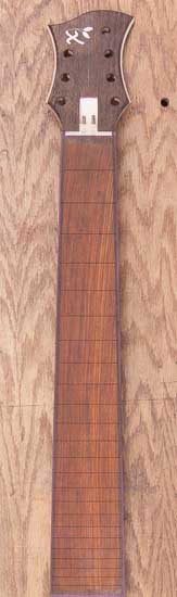 Cocobolo fretboard of a 7-string bass guitar