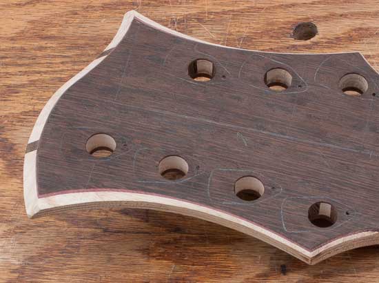 7-string bass headstock with wenge/ash/purpleheart woods