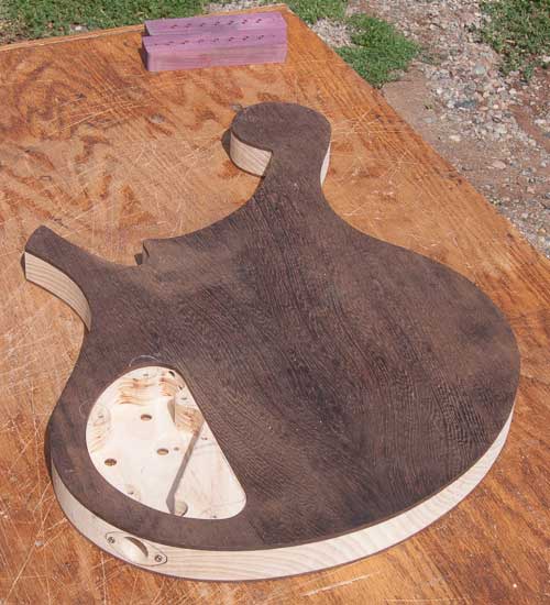 Custom 7-string bass body with ball scroll, back