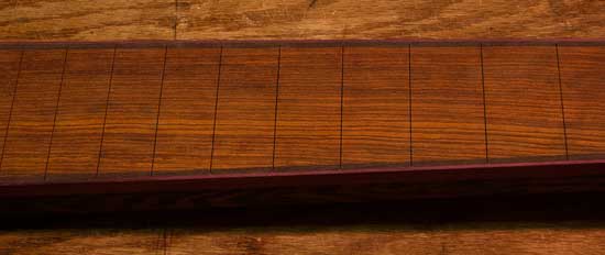 Cocobolo fretboard of a custom 7-string bass