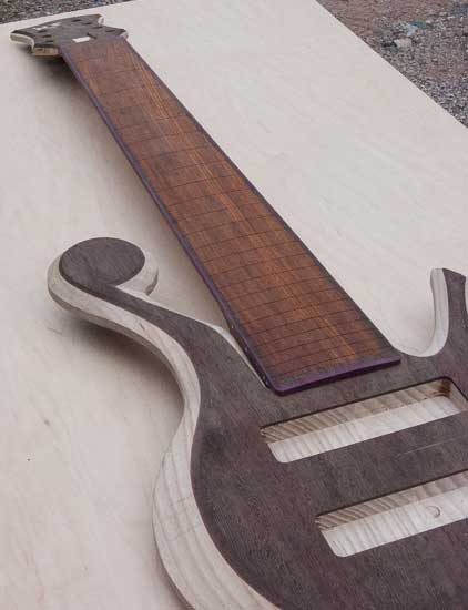 Custom bass with cocobolo fretboard, purpleheart accents