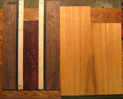The custom bass guitar's mahogany core and cocobolo, maple, ebony and black walnut top wood stripes
