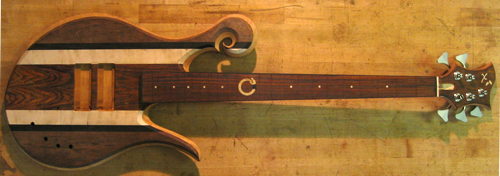 A 5 string Xylem custom bass with striped top wood