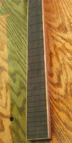 The black limba bound ebony fretboard again
