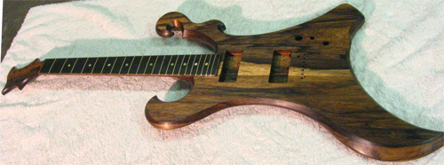 Front of the black limba custom guitar after coats of finish