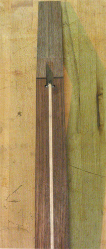 Front of the 7 string guitar's neck blank with a rock maple truss rod spline