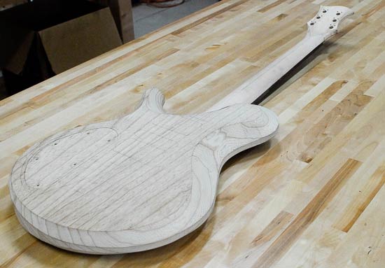 Carved body bevels on a single cut guitar